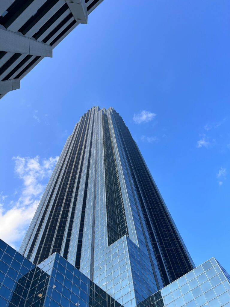 An impressive perspective of Williams Tower against a clear blue sky in Houston, Texas.